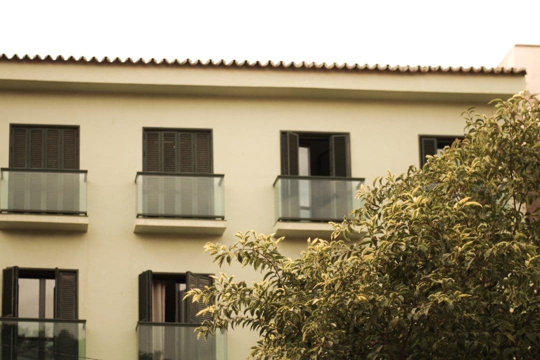 Glass railing balcony on a modern commercial building in India