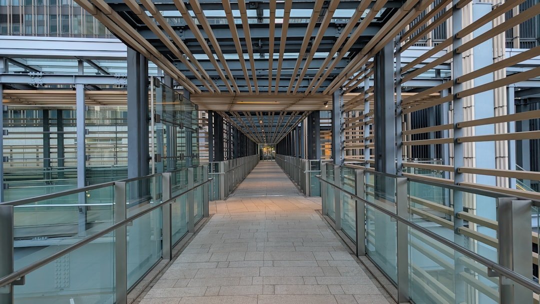 Spigot-fixed glass railing system for balcony applications