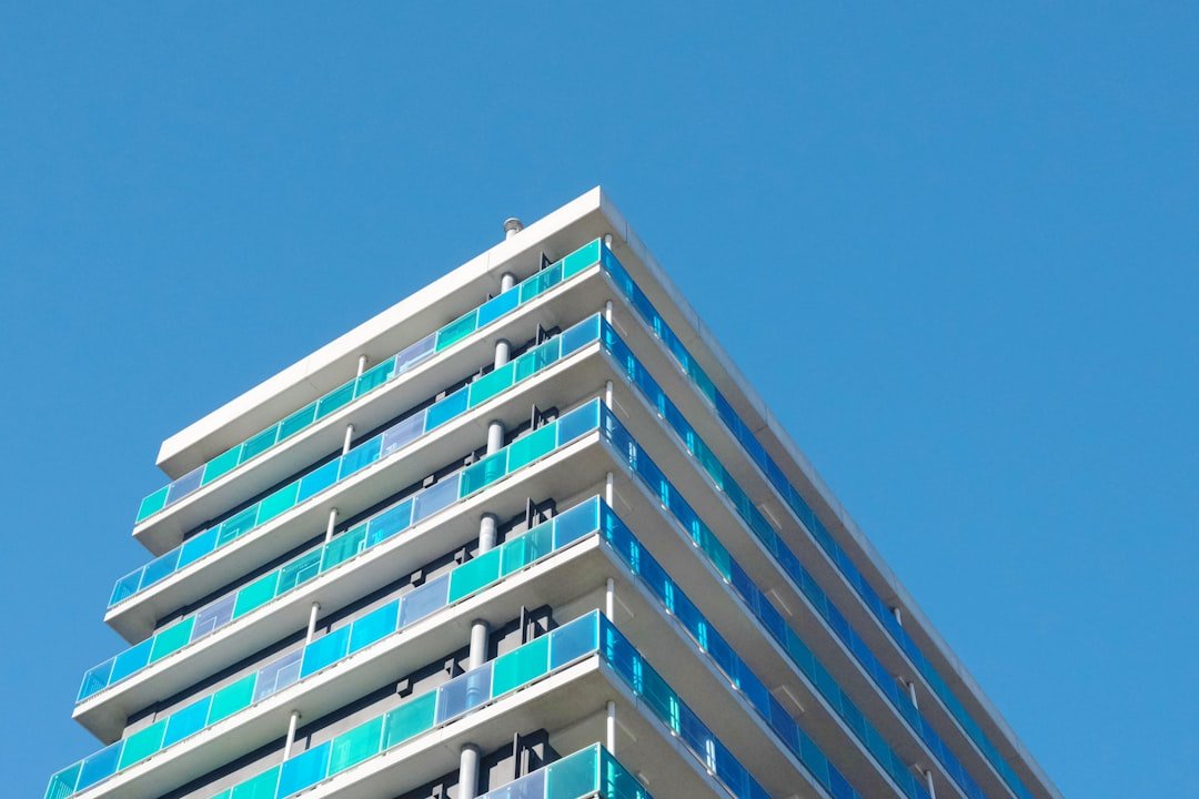 Frameless glass railing system on a high-rise facade